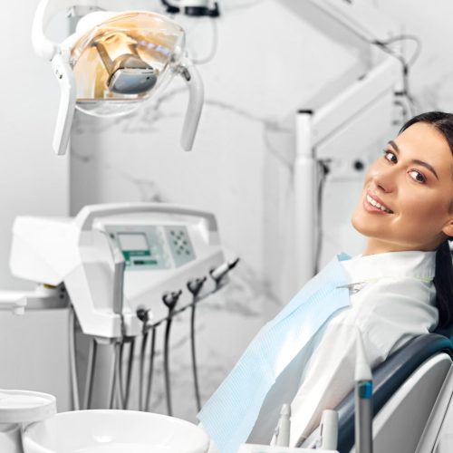 smiling-satisfied-patient-dental-office-after-treatment (1)